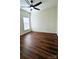 Spacious bedroom with hardwood floors and ceiling fan at 1001 Jessica Ln, Matthews, NC 28104