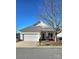 Yellow ranch home with a gray roof, attached garage, and well-maintained lawn at 1001 Jessica Ln, Matthews, NC 28104