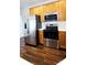 Modern kitchen with stainless steel appliances and wood cabinets at 1001 Jessica Ln, Matthews, NC 28104