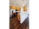 Modern kitchen with island, stainless steel appliances, and wood cabinets at 1001 Jessica Ln, Matthews, NC 28104