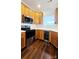 Modern kitchen with stainless steel appliances and wood cabinets at 1001 Jessica Ln, Matthews, NC 28104