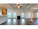 Spacious living room with hardwood floors and fireplace at 1001 Jessica Ln, Matthews, NC 28104