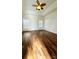 Main bedroom with hardwood floors and tray ceiling at 1001 Jessica Ln, Matthews, NC 28104