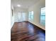 Sunroom featuring hardwood floors and French doors leading outside at 1001 Jessica Ln, Matthews, NC 28104