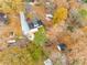 Aerial view of a single Gathering home with fall foliage in the surrounding neighborhood at 110 Yorktowne St, Fort Mill, SC 29715