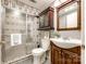 Bathroom with a glass shower and wooden vanity at 110 Yorktowne St, Fort Mill, SC 29715