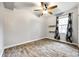 A simple bedroom with hardwood flooring and a ceiling fan at 110 Yorktowne St, Fort Mill, SC 29715