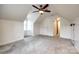 Upstairs bonus room with neutral carpet and lots of natural light at 110 Yorktowne St, Fort Mill, SC 29715