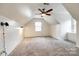 Bonus room with vaulted ceiling, carpet, and natural light at 110 Yorktowne St, Fort Mill, SC 29715