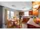 Bright eat-in kitchen featuring wood cabinetry, stainless steel appliances, and a round table at 110 Yorktowne St, Fort Mill, SC 29715