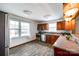 Eat-in kitchen featuring wood cabinetry, stainless steel appliances, granite counters and wood-look flooring at 110 Yorktowne St, Fort Mill, SC 29715