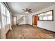 Open living room with wood-look flooring and view to kitchen area through wood framed partition at 110 Yorktowne St, Fort Mill, SC 29715