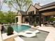 Expansive backyard with a luxurious pool, in-pool loungers, and ample space for recreation at 116 Hunt Camp Trl # 11, Davidson, NC 28036