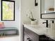 Elegant bathroom with modern fixtures, a decorative plant, and plenty of natural light at 116 Hunt Camp Trl # 11, Davidson, NC 28036