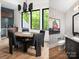 Stylish dining area with modern lighting and convenient access to the wet bar at 116 Hunt Camp Trl # 11, Davidson, NC 28036