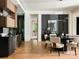 Elegant dining area with a modern table, stylish chairs, and wine storage at 116 Hunt Camp Trl # 11, Davidson, NC 28036