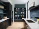 Well-organized kitchen with dark cabinetry, open shelving, and modern fixtures at 116 Hunt Camp Trl # 11, Davidson, NC 28036