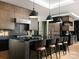 Modern kitchen featuring a large island, stainless steel appliances, and stylish pendant lighting at 116 Hunt Camp Trl # 11, Davidson, NC 28036
