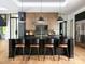 Contemporary kitchen features a dark island with seating and stainless steel appliances at 116 Hunt Camp Trl # 11, Davidson, NC 28036