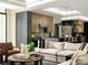 Open concept living room with view to a modern kitchen featuring sleek countertops and stylish decor at 116 Hunt Camp Trl # 11, Davidson, NC 28036