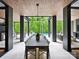 Stunning outdoor dining and entertaining area overlooking a beautiful pool and lush greenery at 116 Hunt Camp Trl # 11, Davidson, NC 28036