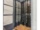 Wine cellar with glass enclosure and wooden racking system at 116 Hunt Camp Trl # 11, Davidson, NC 28036