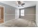 Bright bedroom with ceiling fan, double closet, and neutral walls at 3116 S Legacy Park Blvd, Fort Mill, SC 29707