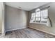 Living room with hardwood floors, large window, and neutral wall colors at 3116 S Legacy Park Blvd, Fort Mill, SC 29707