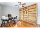 Home office with built-in shelves, desk, and hardwood floors at 3116 S Legacy Park Blvd, Fort Mill, SC 29707