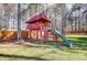 Wooden playset with slide in backyard at 3116 S Legacy Park Blvd, Fort Mill, SC 29707