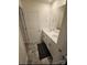 Double vanity bathroom with white cabinets and gray tile floor at 324 Gaines Rd, Clover, SC 29710