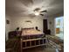 Spacious bedroom boasts a log bed and view into a bathroom at 369 Pinecrest Cir, Troy, NC 27371