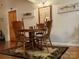Dining room with a wood table set, perfect for Gathering meals, featuring custom fish paintings and decor at 369 Pinecrest Cir, Troy, NC 27371
