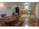 Open-concept kitchen and dining area with stainless steel appliances and plenty of cabinet space at 369 Pinecrest Cir, Troy, NC 27371