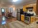 Well-appointed kitchen with stainless steel appliances, adjacent to the dining area and access to the front entry at 369 Pinecrest Cir, Troy, NC 27371
