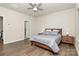 Well-lit bedroom with wood-look floors, and ensuite bathroom access at 5762 Soft Shell Dr, Lancaster, SC 29720