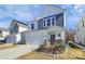 Two-story house with gray and white siding, stone accents, and a two-car garage at 5762 Soft Shell Dr, Lancaster, SC 29720