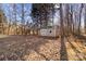 Small shed in a wooded backyard, ideal for storage at 697 Maple Ridge Cir, Salisbury, NC 28147