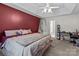 Spacious bedroom with king-size bed, ceiling fan, and workspace at 697 Maple Ridge Cir, Salisbury, NC 28147