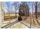 Spacious deck with wooden railings, overlooking a wooded backyard at 697 Maple Ridge Cir, Salisbury, NC 28147