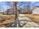 Two-story house with a long driveway and mature trees in the yard at 697 Maple Ridge Cir, Salisbury, NC 28147