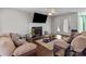 Living room with fireplace, hardwood floors, and two sofas at 697 Maple Ridge Cir, Salisbury, NC 28147