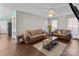 Living room with hardwood floors and access to kitchen at 697 Maple Ridge Cir, Salisbury, NC 28147