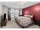 Large main bedroom with king bed and red accent wall at 697 Maple Ridge Cir, Salisbury, NC 28147