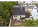 Aerial rear view showcasing the home's roof, backyard, and surrounding trees at 8633 Sawleaf Ct, Charlotte, NC 28215