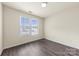 Bedroom features plank floors, bright natural light, and neutral walls at 8633 Sawleaf Ct, Charlotte, NC 28215