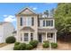 Charming two-story home with a well-manicured lawn and inviting front porch at 8633 Sawleaf Ct, Charlotte, NC 28215