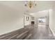 A living room features neutral walls, wood flooring and a fireplace at 8633 Sawleaf Ct, Charlotte, NC 28215