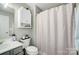 Bathroom with shower/tub combo, vanity, and toilet at 9149 Washam Potts Rd, Cornelius, NC 28031