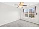 Bedroom with a window, ceiling fan, and neutral wall color at 9149 Washam Potts Rd, Cornelius, NC 28031